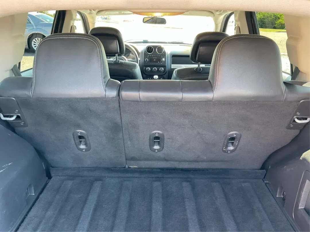 2015 Jeep Compass Altitude Edition (1C4NJCBA6FD) with an 2L I-4 DOHC engine, located at 8750 N County Rd 25A, Piqua, OH, 45356, (937) 908-9800, 40.164391, -84.232513 - 2015 Jeep Compass Altitude Edition - Photo#12