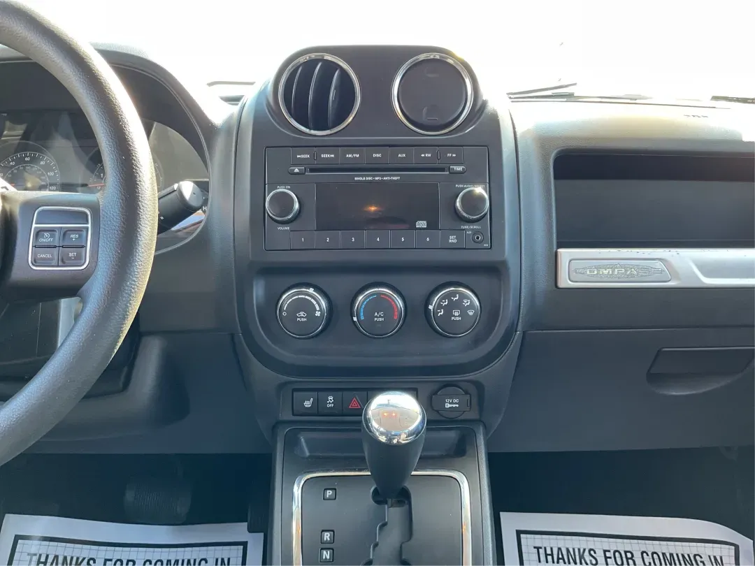 2015 Jeep Compass Altitude Edition (1C4NJCBA6FD) with an 2L I-4 DOHC engine, located at 8750 N County Rd 25A, Piqua, OH, 45356, (937) 908-9800, 40.164391, -84.232513 - 2015 Jeep Compass Altitude Edition - Photo#13