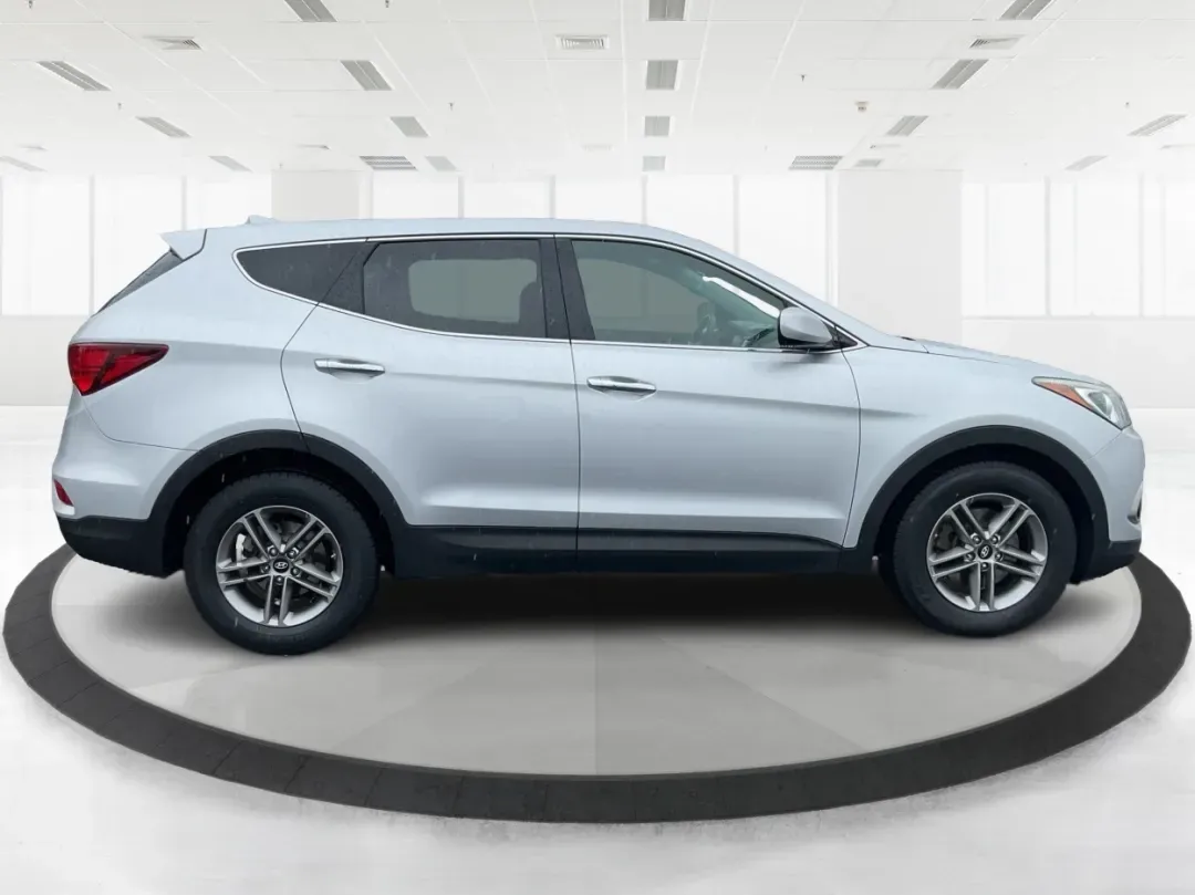 2017 Hyundai Santa Fe 2.4L (5XYZTDLB2HG) with an Theta II 2.4L I-4 gasoline direct injection engine, located at 4508 South Dixie Dr, Moraine, OH, 45439, (937) 908-9800, 39.689976, -84.218452 - Discover the perfect blend of comfort, capability, and style with the 2017 Hyundai Santa Fe, now available at Advantage Car and Credit, located at 1184 Kauffman Ave, Fairborn, OH 45324. This versatile SUV is an excellent choice for growing families, weekend adventurers, or budget-conscious buyers lo - Photo#1