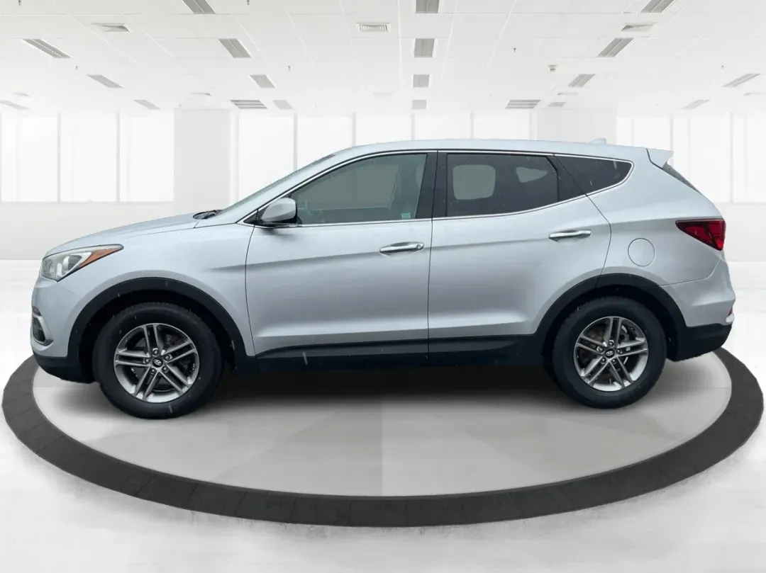 2017 Hyundai Santa Fe 2.4L (5XYZTDLB2HG) with an Theta II 2.4L I-4 gasoline direct injection engine, located at 1951 S Dayton Lakeview Rd., New Carlisle, OH, 45344, (937) 908-9800, 39.890999, -84.050255 - Discover the perfect blend of comfort, capability, and style with the 2017 Hyundai Santa Fe, now available at Advantage Car and Credit, located at 1184 Kauffman Ave, Fairborn, OH 45324. This versatile SUV is an excellent choice for growing families, weekend adventurers, or budget-conscious buyers lo - Photo#5