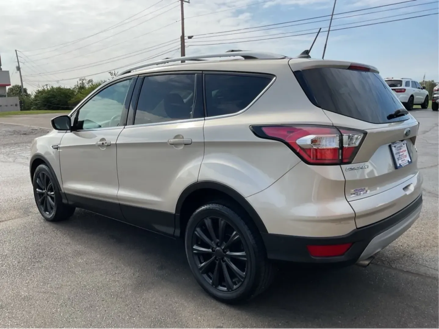 2018 Ford Escape Titanium FWD (1FMCU0J99JU) with an 2.0L L4 DOHC 16V engine, 6-Speed Automatic transmission, located at 1230 East Main St, Xenia, OH, 45385, (937) 908-9800, 39.688026, -83.910172 - Experience the perfect blend of style and practicality with the 2018 Ford Escape Titanium, now available at Advantage Car and Credit in Xenia, OH. This SUV is not just a vehicle; it's your ticket to adventure, whether you're navigating the bustling streets of downtown Xenia or embarking on a weekend - Photo#4
