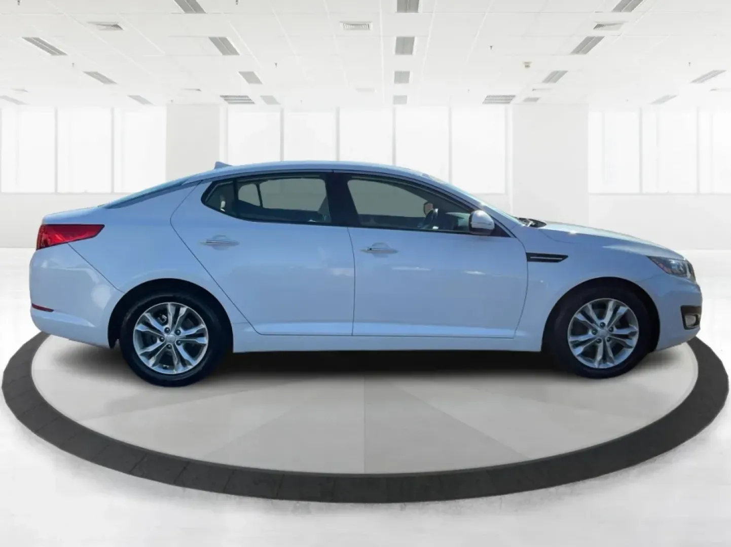 2012 Kia Optima EX (5XXGN4A70CG) with an 2.4L I-4 gasoline direct injection engine, located at 1951 S Dayton Lakeview Rd., New Carlisle, OH, 45344, (937) 908-9800, 39.890999, -84.050255 - Elevate your driving experience with this stunning 2012 Kia Optima EX, a perfect blend of style, comfort, and reliability. Ideal for budget-conscious buyers and growing families alike, this sedan is designed to meet your daily commuting needs while offering the space and features essential for both - Photo#1