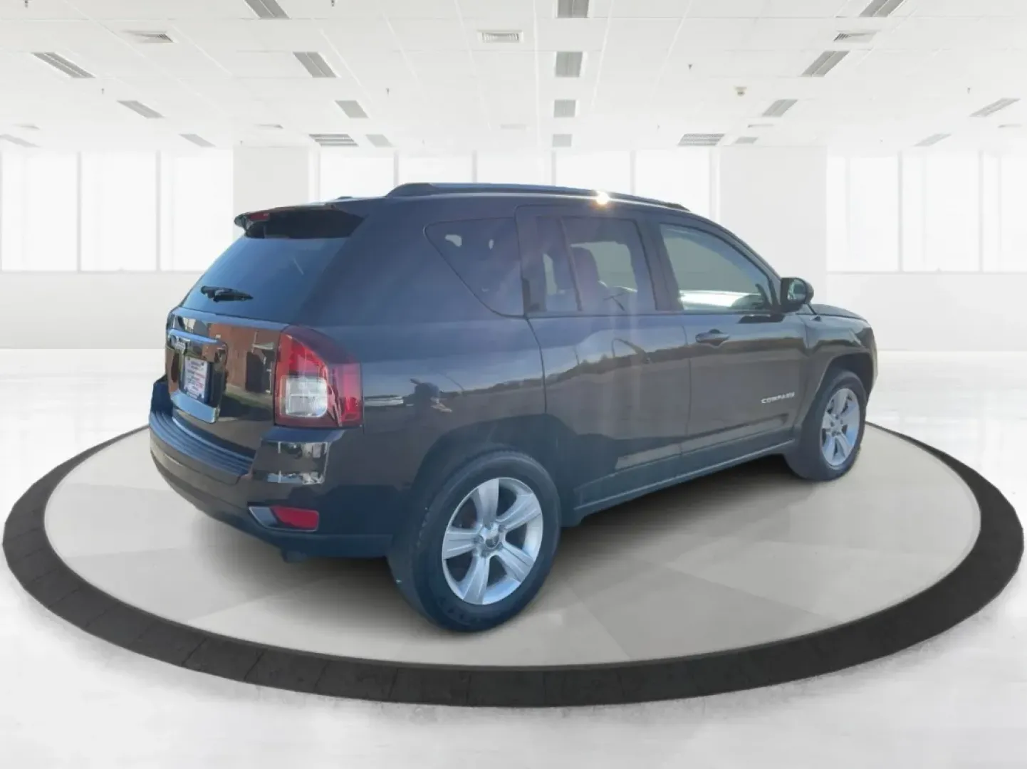 2014 Jeep Compass Sport (1C4NJDBB8ED) with an 2.4L I-4 DOHC engine, located at 1099 N County Rd 25A , Troy, OH, 45373, (937) 908-9800, 40.057079, -84.212883 - Discover the adventure-ready 2014 Jeep Compass, an SUV that's perfect for weekend getaways and daily commutes alike. Whether you're navigating the bustling streets of Troy or heading out on a family road trip to nearby attractions like the Miami County Fair, this rugged vehicle will elevate your dri - Photo#2