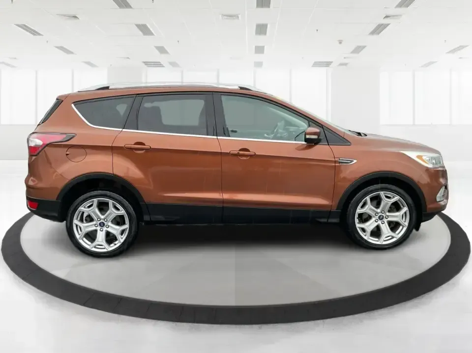 2017 Ford Escape Titanium 4WD (1FMCU9J94HU) with an 2.0L L4 DOHC 16V engine, 6A transmission, located at 8750 N County Rd 25A, Piqua, OH, 45356, (937) 908-9800, 40.164391, -84.232513 - Load up the family, point the hood toward Indian Lake for a weekend escape, or make your daily commute down I75 feel a lot more comfortable-this 2017 Ford Escape Titanium 4WD is the kind of compact SUV that fits real life in Piqua, OH. With confident four-wheel drive for unpredictable Midwest weathe - Photo#1