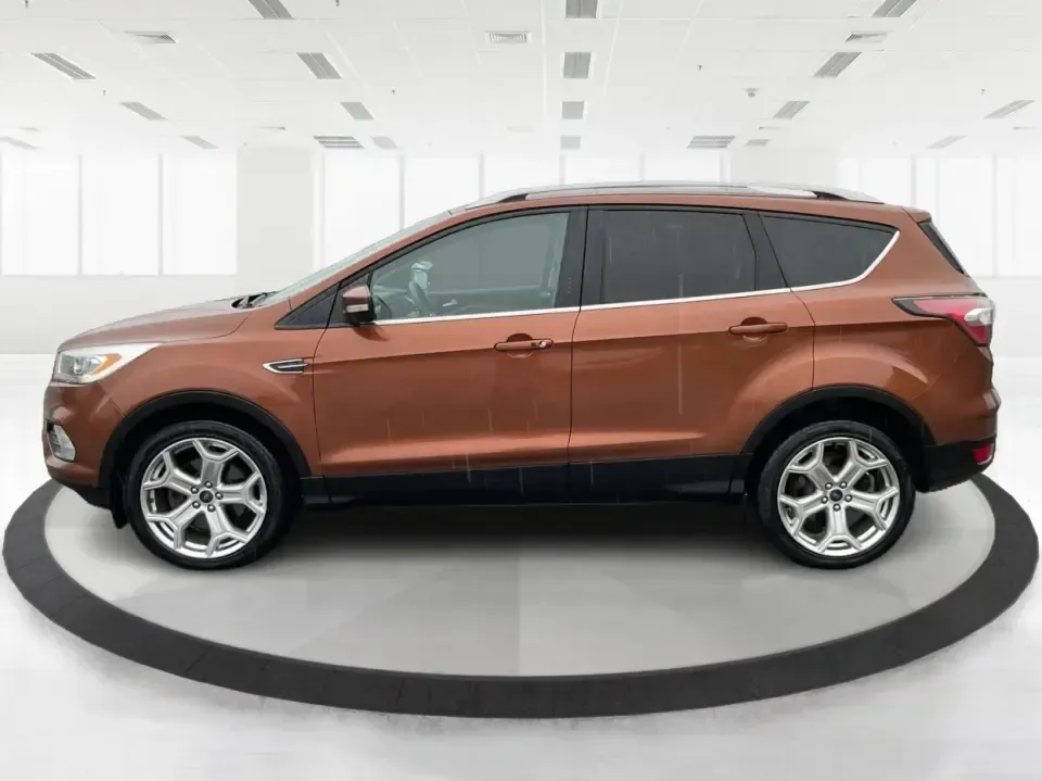 2017 Ford Escape Titanium 4WD (1FMCU9J94HU) with an 2.0L L4 DOHC 16V engine, 6A transmission, located at 8750 N County Rd 25A, Piqua, OH, 45356, (937) 908-9800, 40.164391, -84.232513 - Load up the family, point the hood toward Indian Lake for a weekend escape, or make your daily commute down I75 feel a lot more comfortable-this 2017 Ford Escape Titanium 4WD is the kind of compact SUV that fits real life in Piqua, OH. With confident four-wheel drive for unpredictable Midwest weathe - Photo#5