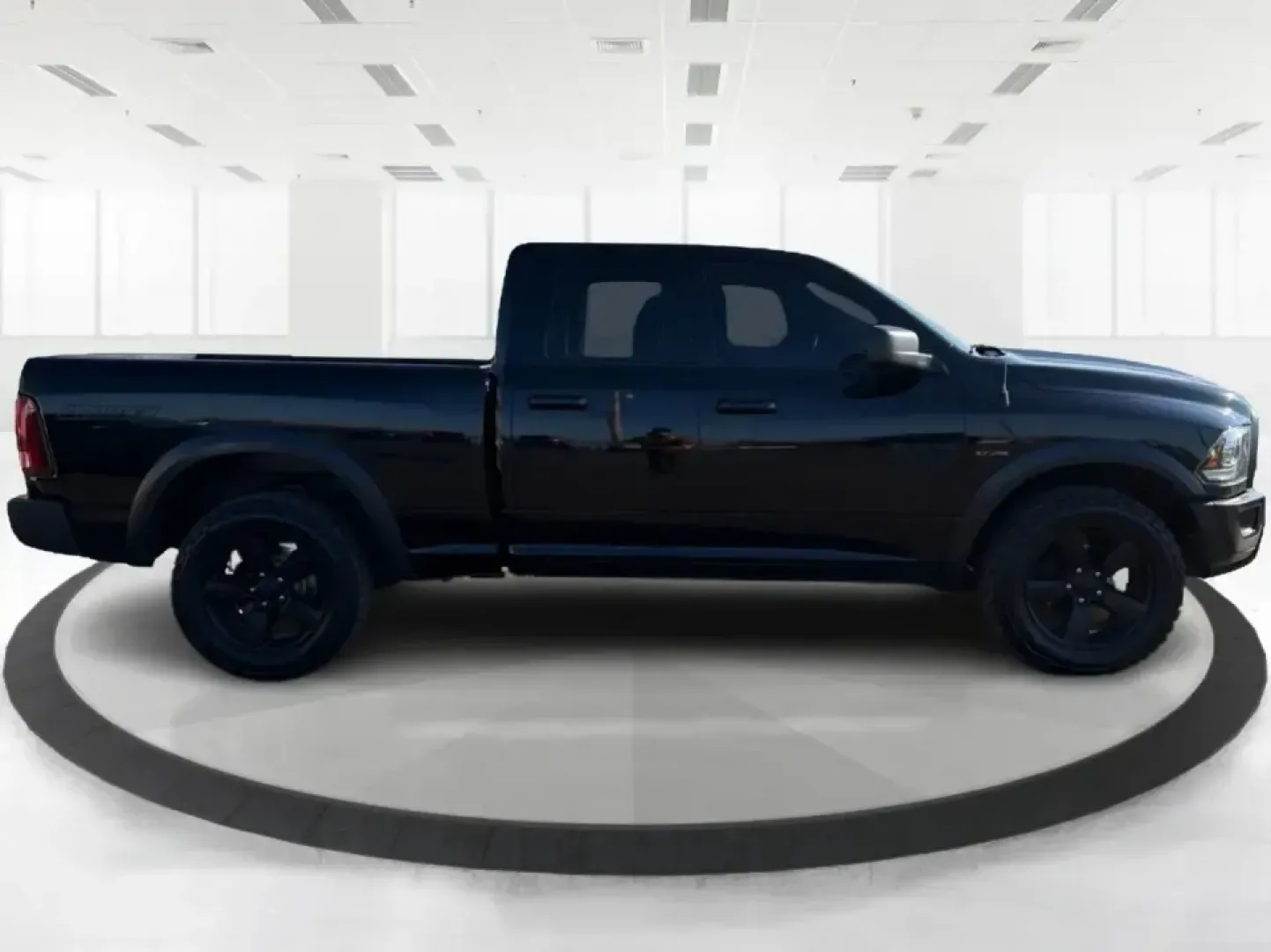2019 Ram 1500 Warlock Quad Cab 4x4 6'4 Box (1C6RR7GT7KS) with an 5.7L V8 OHV 16V engine, 8A transmission, located at 1951 S Dayton Lakeview Rd., New Carlisle, OH, 45344, (937) 908-9800, 39.890999, -84.050255 - If your weekends revolve around hauling gear to Buck Creek State Park, towing a trailer to a jobsite, or packing up the family for a road trip out I70, this 2019 Ram 1500 Warlock Quad Cab 4x4 is the kind of truck that fits real life in New Carlisle. With its bold Brilliant Black Crystal Pearlcoat fi- Photo#1