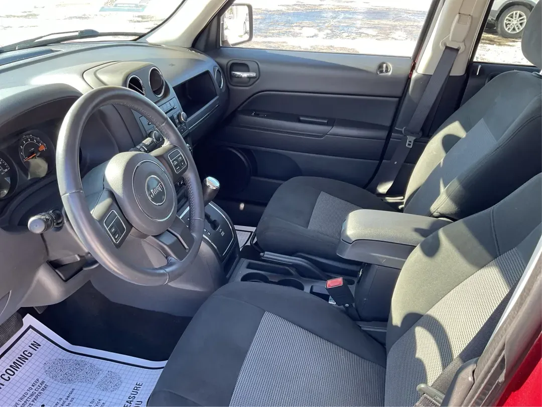 2014 Jeep Patriot Latitude (1C4NJRFB3ED) with an 2.4L I-4 DOHC engine, located at 880 E. National Road, Vandalia, OH, 45377, (937) 908-9800, 39.891918, -84.183594 - **Adventure Awaits with This 2014 Jeep Patriot Latitude Perfect for Your Next Journey!**<br /> <br /> Are you ready to embrace the thrill of the open road? Whether you're planning a weekend getaway or just need a reliable companion for your daily commute, this 2014 Jeep Patriot Latitude is designed - Photo#9
