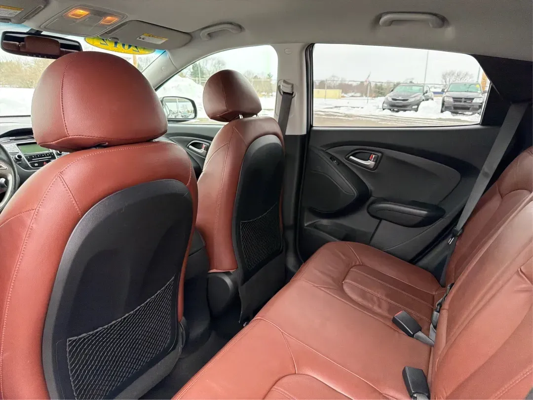 2012 Hyundai Tucson Limited (KM8JU3AC5CU) with an Theta II 2.4L I-4 DOHC engine, 6-Speed Automatic transmission, located at 880 E. National Road, Vandalia, OH, 45377, (937) 908-9800, 39.891918, -84.183594 - Need a dependable SUV that fits real life-school drop-offs, I-75 commuting, and weekend getaways to Taylorsville MetroPark-without the stress of traditional bank rules? This 2012 Hyundai Tucson Limited in Ash Black is a smart, comfortable choice for Vandalia drivers who want a practical daily vehicl - Photo#10