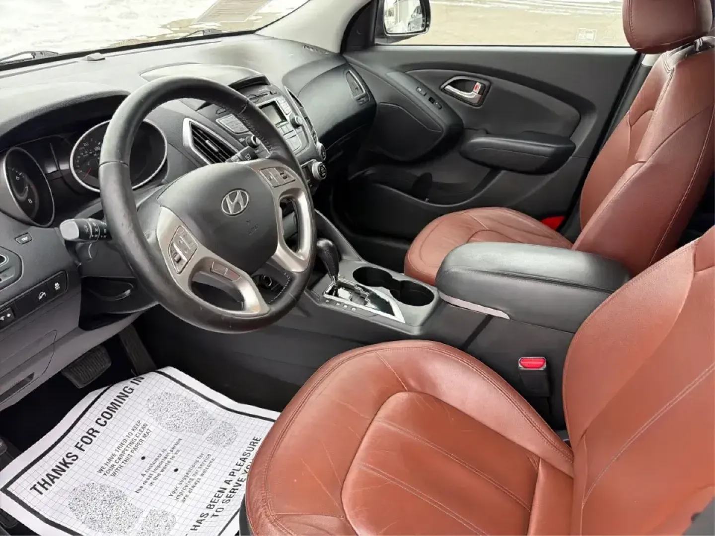 2012 Hyundai Tucson Limited (KM8JU3AC5CU) with an Theta II 2.4L I-4 DOHC engine, 6-Speed Automatic transmission, located at 880 E. National Road, Vandalia, OH, 45377, (937) 908-9800, 39.891918, -84.183594 - Need a dependable SUV that fits real life-school drop-offs, I-75 commuting, and weekend getaways to Taylorsville MetroPark-without the stress of traditional bank rules? This 2012 Hyundai Tucson Limited in Ash Black is a smart, comfortable choice for Vandalia drivers who want a practical daily vehicl - Photo#9