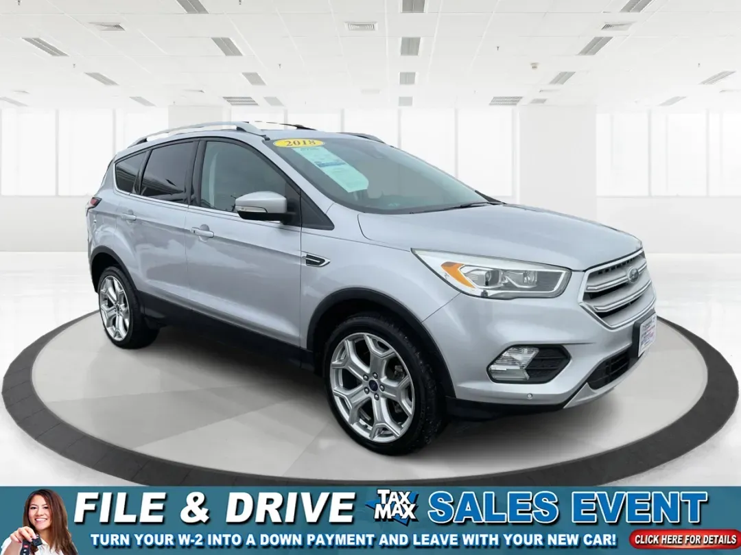 2018 Ford Escape Titanium (1FMCU9J97JU) with an EcoBoost 2L I-4 gasoline direct injection engine, 6A transmission, located at 1099 N County Rd 25A , Troy, OH, 45373, (937) 908-9800, 40.057079, -84.212883 - Need an SUV that can handle Ohio weather, daily commutes, and weekend getaways without feeling like a compromise? This 2018 Ford Escape Titanium 4WD in Ingot Silver Metallic is built for real life in Troy-whether you're shuttling kids across town, driving a long commute down I-75, or loading up for - Photo#0