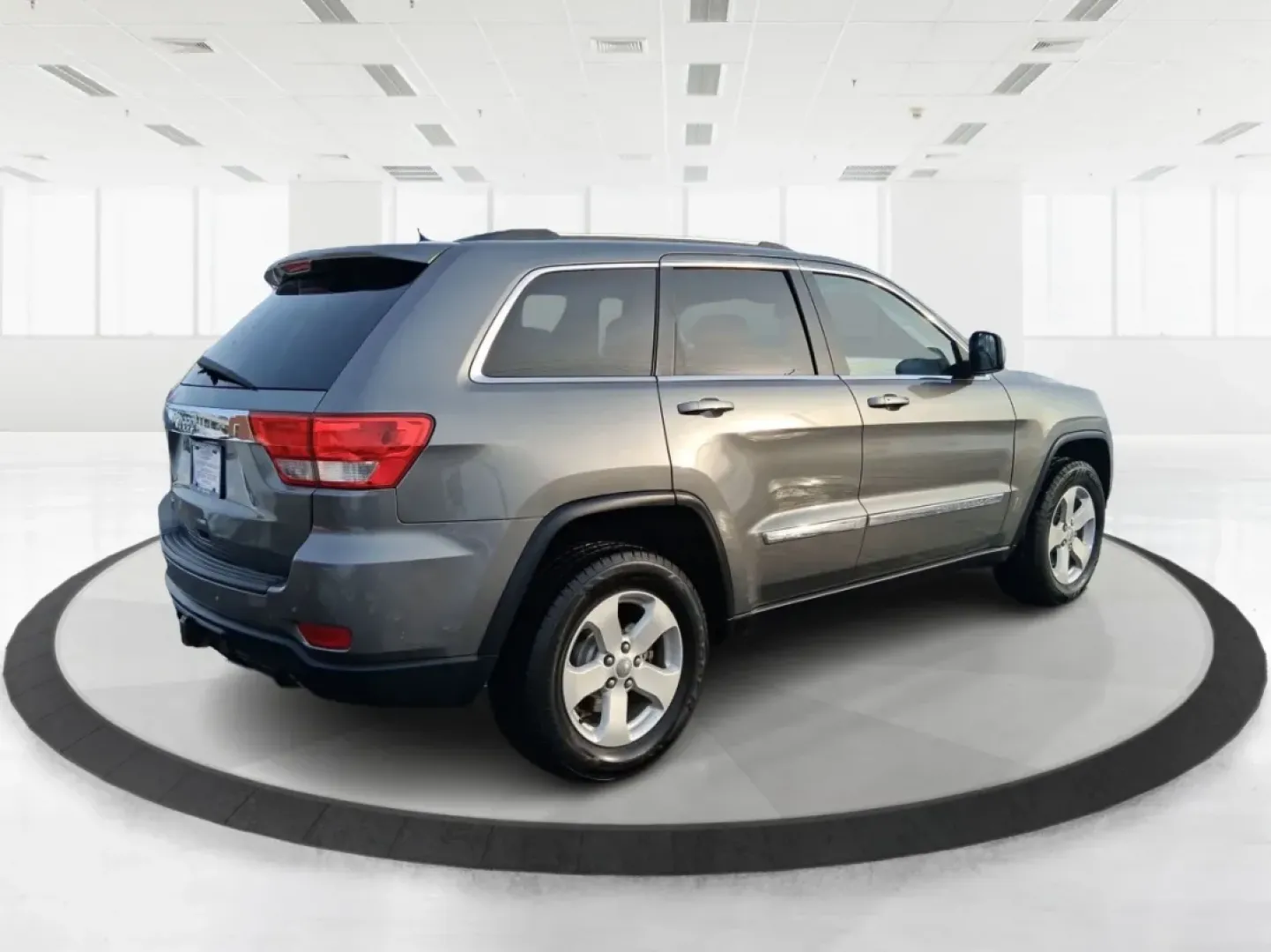 2012 Jeep Grand Cherokee Laredo (1C4RJFAG1CC) with an Other engine, located at 1099 N County Rd 25A , Troy, OH, 45373, (937) 908-9800, 40.057079, -84.212883 - Picture your next weekend escape: loading up the family, pointing the hood toward John A. Wannemacher Nature Reserve, and cruising I75 with confidence no matter what Ohio weather throws your way. This 2012 Jeep Grand Cherokee Laredo is built for real life in Troy-school runs, long commutes to Dayton - Photo#2