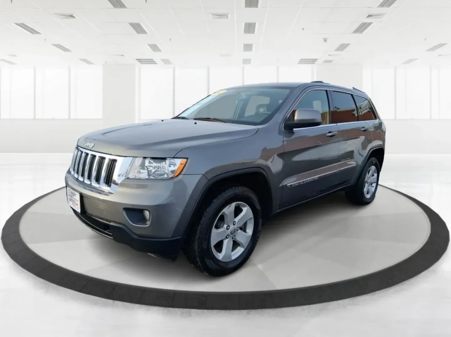 2012 Jeep Grand Cherokee Laredo (1C4RJFAG1CC) with an Other engine, located at 1099 N County Rd 25A , Troy, OH, 45373, (937) 908-9800, 40.057079, -84.212883 - Picture your next weekend escape: loading up the family, pointing the hood toward John A. Wannemacher Nature Reserve, and cruising I75 with confidence no matter what Ohio weather throws your way. This 2012 Jeep Grand Cherokee Laredo is built for real life in Troy-school runs, long commutes to Dayton - Photo#8
