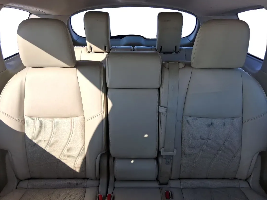 2013 Infiniti JX35 Base (5N1AL0MM9DC) with an 3.5L V6 DOHC 24V engine, Continuously Variable Transmission transmission, located at 1951 S Dayton Lakeview Rd., New Carlisle, OH, 45344, (937) 908-9800, 39.890999, -84.050255 - Need a comfortable, upscale SUV that can handle school drop-offs, I70 commutes, and weekend getaways without blowing the budget? This 2013 INFINITI JX35 Base in rich maroon delivers three-row versatility, premium comfort, and confidence-building safety features-an ideal fit for growing families, bus - Photo#12