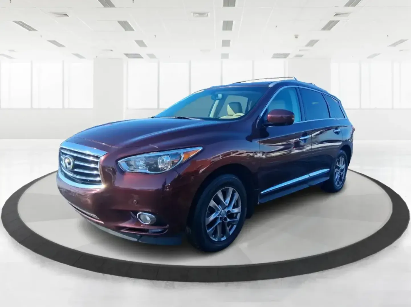 2013 Infiniti JX35 Base (5N1AL0MM9DC) with an 3.5L V6 DOHC 24V engine, Continuously Variable Transmission transmission, located at 1184 Kauffman Ave, Fairborn, OH, 45324, (937) 908-9800, 39.807072, -84.030914 - Need a comfortable, upscale SUV that can handle school drop-offs, I70 commutes, and weekend getaways without blowing the budget? This 2013 INFINITI JX35 Base in rich maroon delivers three-row versatility, premium comfort, and confidence-building safety features-an ideal fit for growing families, bus - Photo#5