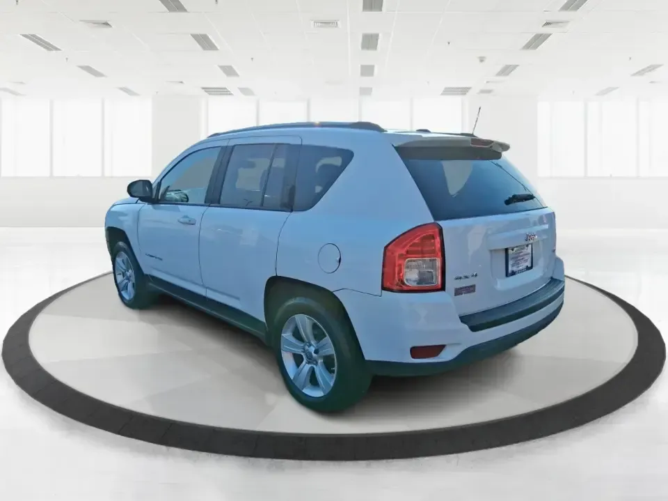 2012 Jeep Compass Latitude (1C4NJDEB4CD) with an 2.4L I-4 DOHC engine, Continuously Variable Transmission transmission, located at 4508 South Dixie Dr, Moraine, OH, 45439, (937) 908-9800, 39.689976, -84.218452 - Need a do-it-all SUV that fits real life in West Central Ohio-school drop-offs, long commutes up I75, and spontaneous weekend escapes to the trails around Johnston Farm and Indian Agency? This 2012 Jeep Compass Latitude 4WD in Bright White Clearcoat is built for that everyday adventure lifestyle, - Photo#4