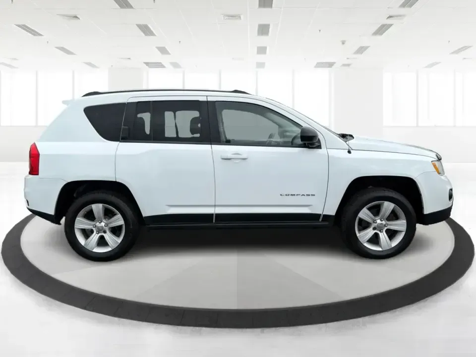 2012 Jeep Compass Latitude (1C4NJDEB4CD) with an 2.4L I-4 DOHC engine, Continuously Variable Transmission transmission, located at 1230 East Main St, Xenia, OH, 45385, (937) 908-9800, 39.688026, -83.910172 - Need a do-it-all SUV that fits real life in West Central Ohio-school drop-offs, long commutes up I75, and spontaneous weekend escapes to the trails around Johnston Farm and Indian Agency? This 2012 Jeep Compass Latitude 4WD in Bright White Clearcoat is built for that everyday adventure lifestyle, - Photo#1