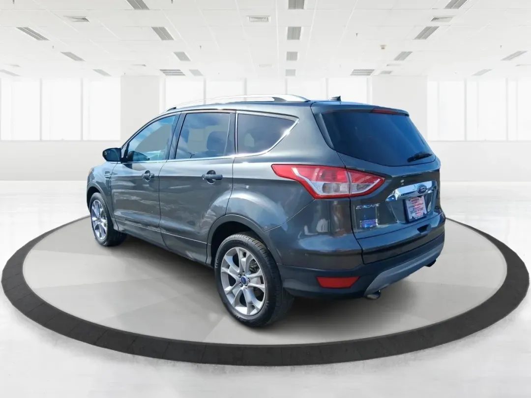 2016 Ford Escape Titanium (1FMCU9J94GU) with an 2.0L L4 DOHC 16V engine, 6-Speed Automatic transmission, located at 1951 S Dayton Lakeview Rd., New Carlisle, OH, 45344, (937) 908-9800, 39.890999, -84.050255 - Picture your next Ohio weekend: a quick grocery run through New Carlisle, a comfortable commute toward Dayton, and then a spontaneous road trip out I70 with the family-without worrying about weather, cargo space, or comfort. This 2016 Ford Escape Titanium in sleek Magnetic is the kind of compact SUV - Photo#4