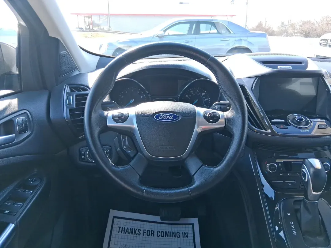 2016 Ford Escape Titanium (1FMCU9J94GU) with an 2.0L L4 DOHC 16V engine, 6-Speed Automatic transmission, located at 1951 S Dayton Lakeview Rd., New Carlisle, OH, 45344, (937) 908-9800, 39.890999, -84.050255 - Picture your next Ohio weekend: a quick grocery run through New Carlisle, a comfortable commute toward Dayton, and then a spontaneous road trip out I70 with the family-without worrying about weather, cargo space, or comfort. This 2016 Ford Escape Titanium in sleek Magnetic is the kind of compact SUV - Photo#16