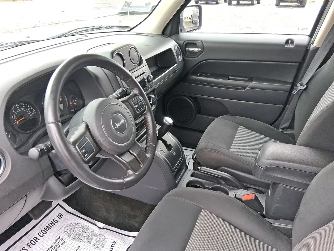 2016 Jeep Patriot Latitude (1C4NJPFA8GD) with an 2.0L L4 DOHC 16V engine, located at 1951 S Dayton Lakeview Rd., New Carlisle, OH, 45344, (937) 908-9800, 39.890999, -84.050255 - Picture your next weekend escape: loading up the gear, pointing the hood toward John Bryan State Park or a day trip to Dayton, and enjoying the confident, go-anywhere feel that makes a Jeep a Jeep. This **2016 Jeep Patriot Latitude** is a smart fit for commuters, first-time buyers, and budget-consci - Photo#9