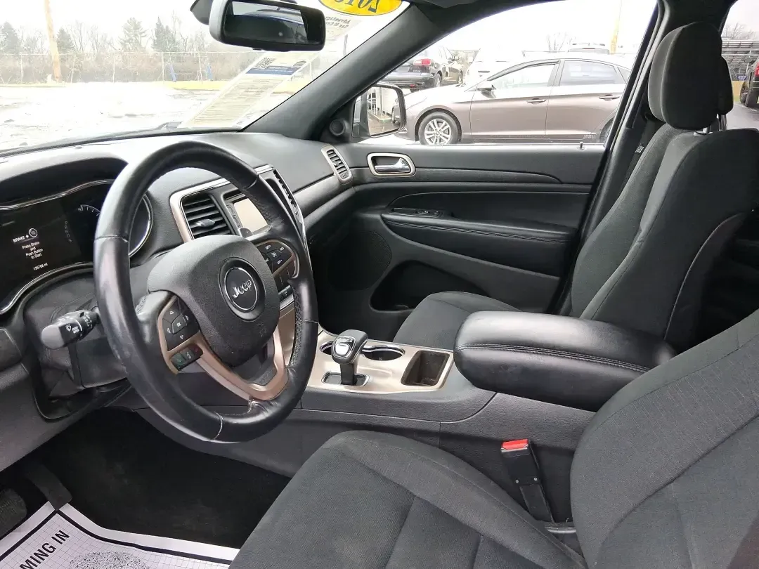 2015 Jeep Grand Cherokee Laredo (1C4RJFAG1FC) with an 3.6L V-6 DOHC engine, 8-Speed Automatic transmission, located at 1951 S Dayton Lakeview Rd., New Carlisle, OH, 45344, (937) 908-9800, 39.890999, -84.050255 - Picture a weekend that starts with a smooth commute through Clark County and ends with a spontaneous road trip-camp gear in the back, friends in the second row, and confidence when the weather turns. This 2015 Jeep Grand Cherokee Laredo is built for real life in Ohio: school runs, long drives down I - Photo#9