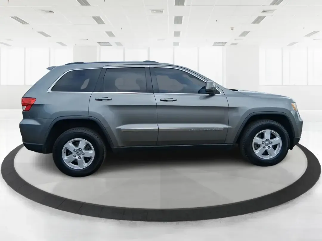 2013 Jeep Grand Cherokee Laredo (1C4RJFAG1DC) with an 3.6L V6 DOHC 24V engine, 5-Speed Automatic transmission, located at 401 Woodman Dr, Riverside, OH, 45431, (937) 908-9800, 39.760899, -84.123421 - Pack up the family, point the hood toward the next weekend getaway, and enjoy the confidence that comes with a capable SUV built for real life in Ohio. This 2013 Jeep Grand Cherokee Laredo in Mineral Gray Metallic Clearcoat is the kind of vehicle that fits your routine Monday through Friday-then tur - Photo#1