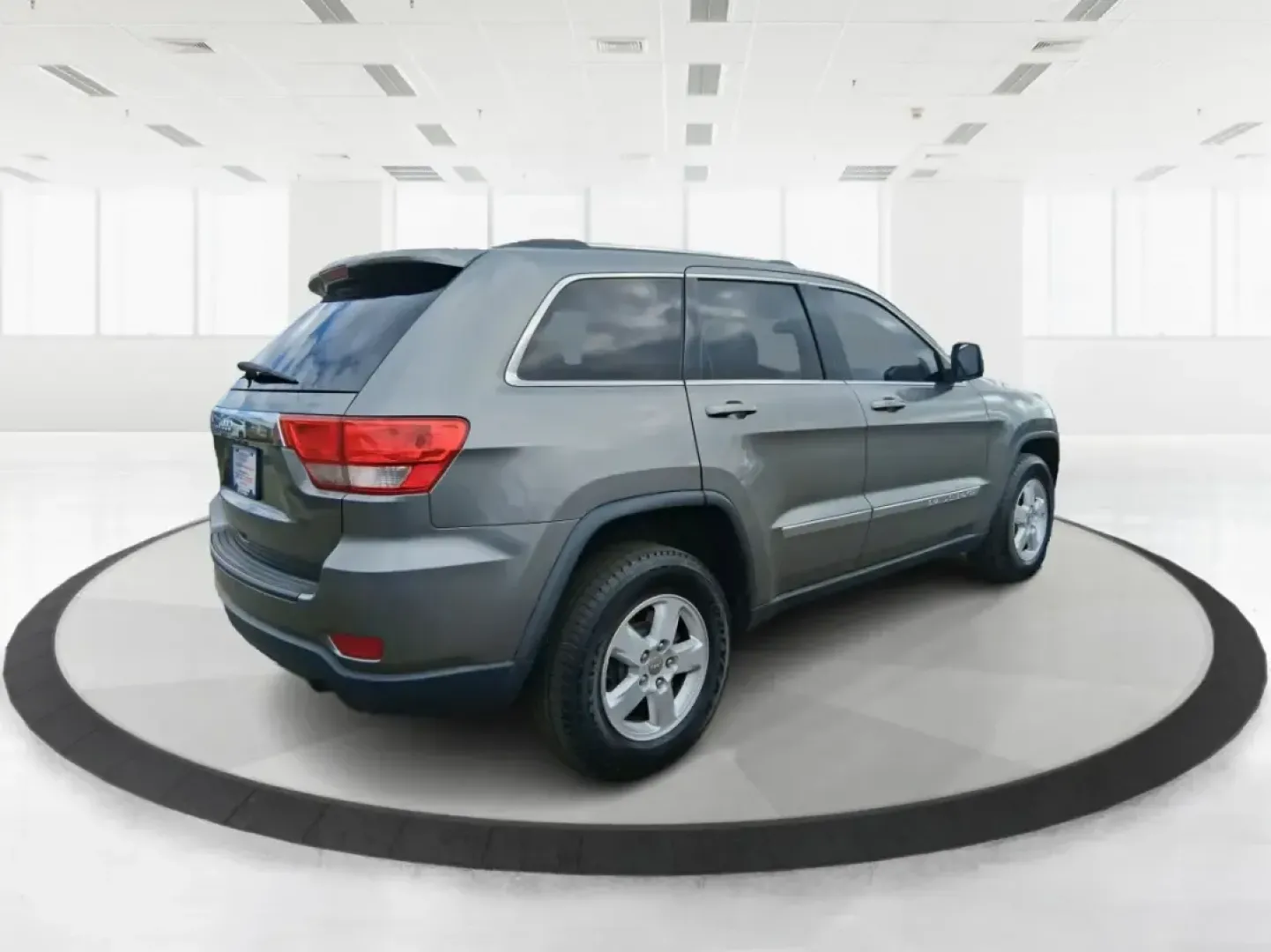 2013 Jeep Grand Cherokee Laredo (1C4RJFAG1DC) with an 3.6L V6 DOHC 24V engine, 5-Speed Automatic transmission, located at 401 Woodman Dr, Riverside, OH, 45431, (937) 908-9800, 39.760899, -84.123421 - Pack up the family, point the hood toward the next weekend getaway, and enjoy the confidence that comes with a capable SUV built for real life in Ohio. This 2013 Jeep Grand Cherokee Laredo in Mineral Gray Metallic Clearcoat is the kind of vehicle that fits your routine Monday through Friday-then tur - Photo#2