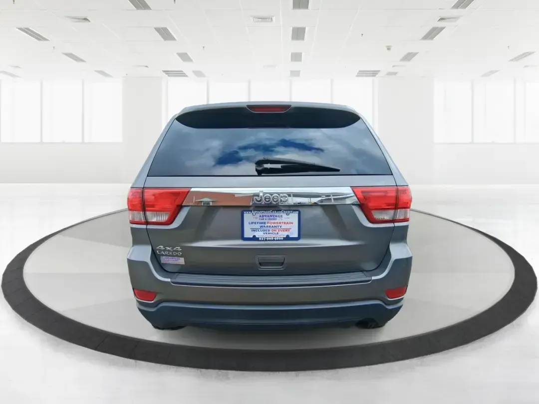 2013 Jeep Grand Cherokee Laredo (1C4RJFAG1DC) with an 3.6L V6 DOHC 24V engine, 5-Speed Automatic transmission, located at 401 Woodman Dr, Riverside, OH, 45431, (937) 908-9800, 39.760899, -84.123421 - Pack up the family, point the hood toward the next weekend getaway, and enjoy the confidence that comes with a capable SUV built for real life in Ohio. This 2013 Jeep Grand Cherokee Laredo in Mineral Gray Metallic Clearcoat is the kind of vehicle that fits your routine Monday through Friday-then tur - Photo#3