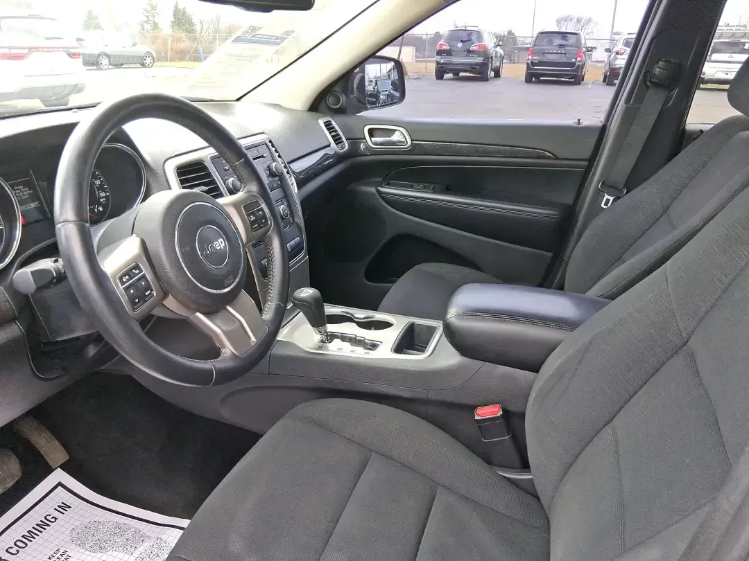 2013 Jeep Grand Cherokee Laredo (1C4RJFAG1DC) with an 3.6L V6 DOHC 24V engine, 5-Speed Automatic transmission, located at 401 Woodman Dr, Riverside, OH, 45431, (937) 908-9800, 39.760899, -84.123421 - Pack up the family, point the hood toward the next weekend getaway, and enjoy the confidence that comes with a capable SUV built for real life in Ohio. This 2013 Jeep Grand Cherokee Laredo in Mineral Gray Metallic Clearcoat is the kind of vehicle that fits your routine Monday through Friday-then tur - Photo#9