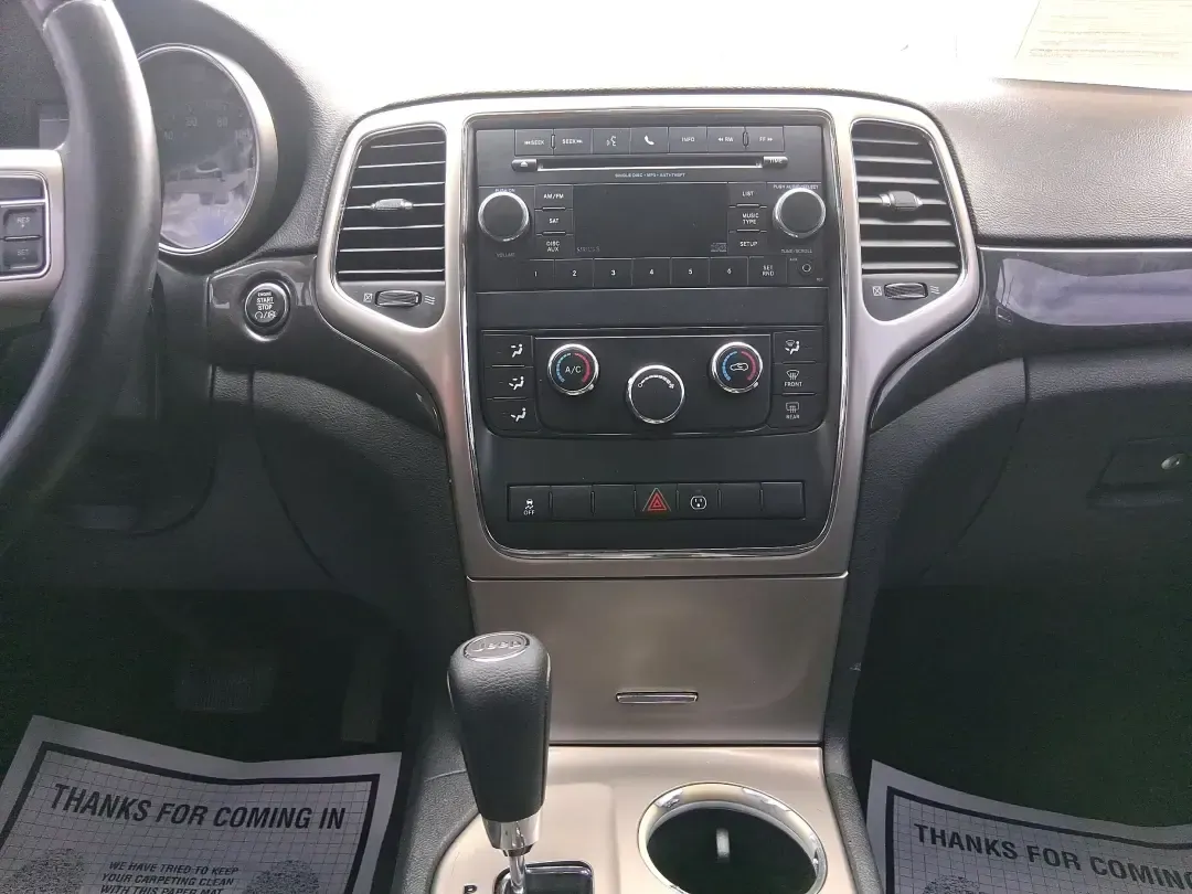 2013 Jeep Grand Cherokee Laredo (1C4RJFAG1DC) with an 3.6L V6 DOHC 24V engine, 5-Speed Automatic transmission, located at 401 Woodman Dr, Riverside, OH, 45431, (937) 908-9800, 39.760899, -84.123421 - Pack up the family, point the hood toward the next weekend getaway, and enjoy the confidence that comes with a capable SUV built for real life in Ohio. This 2013 Jeep Grand Cherokee Laredo in Mineral Gray Metallic Clearcoat is the kind of vehicle that fits your routine Monday through Friday-then tur - Photo#13