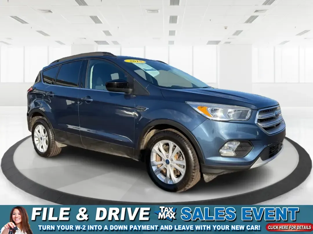 2018 Ford Escape SE (1FMCU9GD4JU) with an 1.5L L4 DOHC 16V engine, 6A transmission, located at 1230 East Main St, Xenia, OH, 45385, (937) 908-9800, 39.688026, -83.910172 - Picture your next Ohio weekend: loading up the kids for a splash at Splash Xenia, cruising out to John Bryan State Park for a hike, or tackling a snowy morning commute from Beavercreek to downtown Dayton with confidence. This 2018 Ford Escape SE in Blue Metallic is the kind of compact SUV that fits - Photo#0