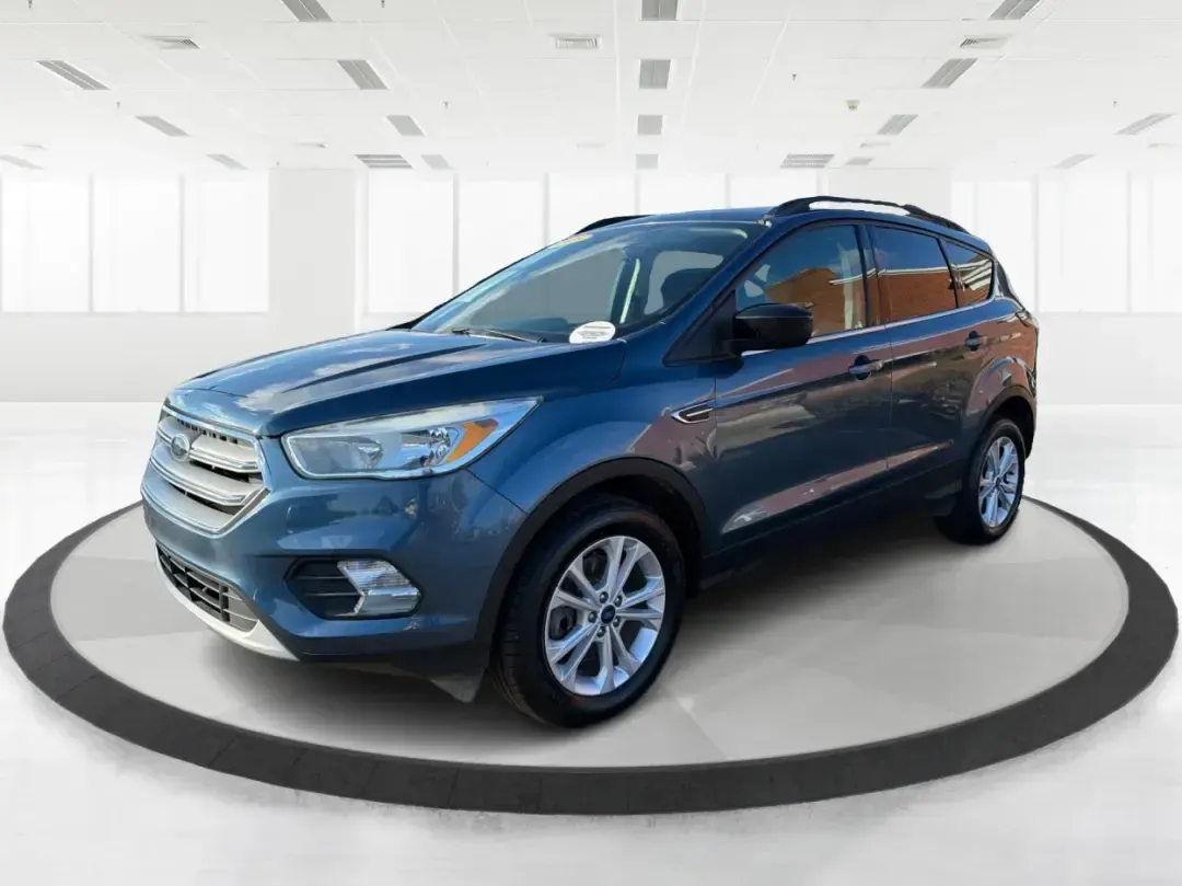 2018 Ford Escape SE (1FMCU9GD4JU) with an 1.5L L4 DOHC 16V engine, 6A transmission, located at 1230 East Main St, Xenia, OH, 45385, (937) 908-9800, 39.688026, -83.910172 - Picture your next Ohio weekend: loading up the kids for a splash at Splash Xenia, cruising out to John Bryan State Park for a hike, or tackling a snowy morning commute from Beavercreek to downtown Dayton with confidence. This 2018 Ford Escape SE in Blue Metallic is the kind of compact SUV that fits - Photo#8