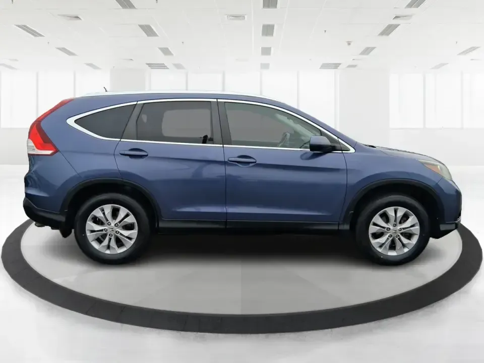 2013 Honda CR-V EX-L (2HKRM4H74DH) with an 2.4L I-4 DOHC engine, 5-Speed Automatic transmission, located at 1099 N County Rd 25A , Troy, OH, 45373, (937) 908-9800, 40.057079, -84.212883 - Picture your next weekend: a quick run up I75 for a Dayton Dragons game, a family trip to Treasure Island Park, or a snowy school-morning commute across Troy-without stressing about space, comfort, or traction. This 2013 Honda CRV EXL in Twilight Blue Metallic is the kind of do-it-all SUV that fits - Photo#1