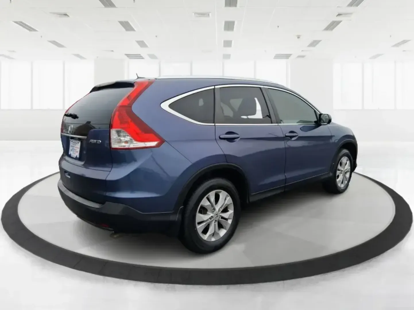 2013 Honda CR-V EX-L 4WD 5-Speed AT (2HKRM4H74DH) with an 2.4L L4 DOHC 16V engine, 5-Speed Automatic transmission, located at 1184 Kauffman Ave, Fairborn, OH, 45324, (937) 908-9800, 39.807072, -84.030914 - Picture your next Ohio weekend: loading up for a short road trip to Yellow Springs, meeting friends near Wright-Patterson Air Force Base, or tackling a snowy commute on I-675 with confidence. This 2013 Honda CR-V EX-L in Twilight Blue Metallic is the kind of practical, comfortable SUV that fits real- Photo#2