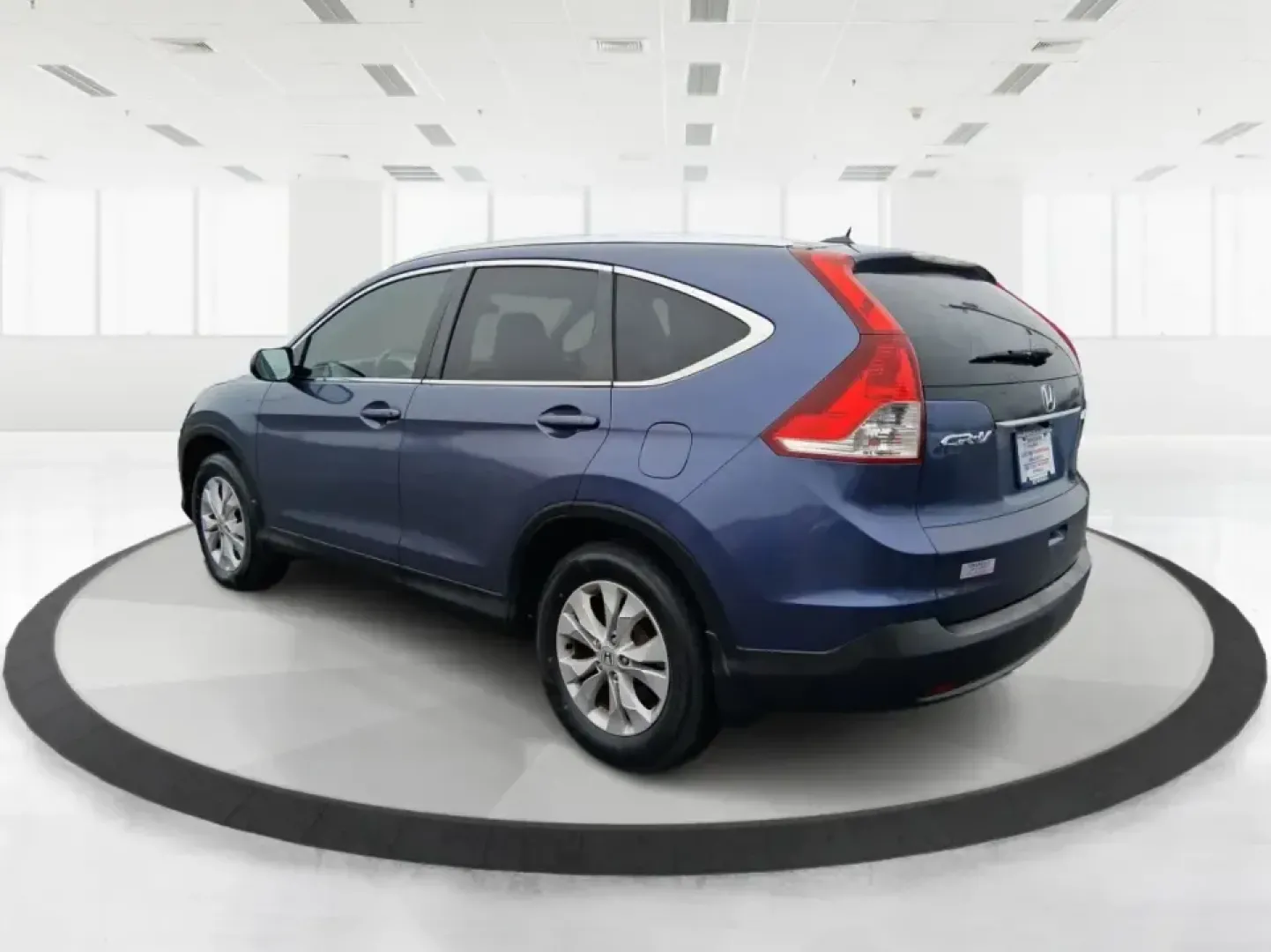 2013 Honda CR-V EX-L 4WD 5-Speed AT (2HKRM4H74DH) with an 2.4L L4 DOHC 16V engine, 5-Speed Automatic transmission, located at 1184 Kauffman Ave, Fairborn, OH, 45324, (937) 908-9800, 39.807072, -84.030914 - Picture your next Ohio weekend: loading up for a short road trip to Yellow Springs, meeting friends near Wright-Patterson Air Force Base, or tackling a snowy commute on I-675 with confidence. This 2013 Honda CR-V EX-L in Twilight Blue Metallic is the kind of practical, comfortable SUV that fits real- Photo#4