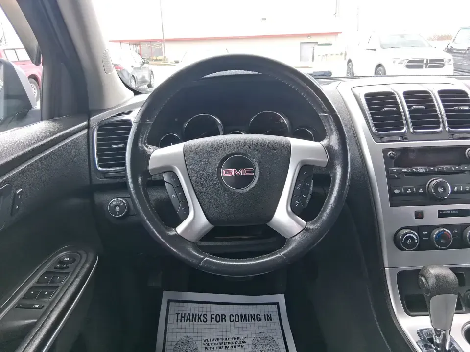 2012 GMC Acadia SL (1GKKRNED6CJ) with an 3.6L V-6 gasoline direct injection engine, 6-Speed Automatic transmission, located at 8750 N County Rd 25A, Piqua, OH, 45356, (937) 908-9800, 40.164391, -84.232513 - Pack up the kids, load the cooler, and point the SUV toward your next weekend getaway-this 2012 GMC Acadia SL is built for real-life Ohio driving, from school drop-offs and long commutes to road trips up I-75 and errands around Piqua. With three-row versatility, confident road manners, and family-fr - Photo#16