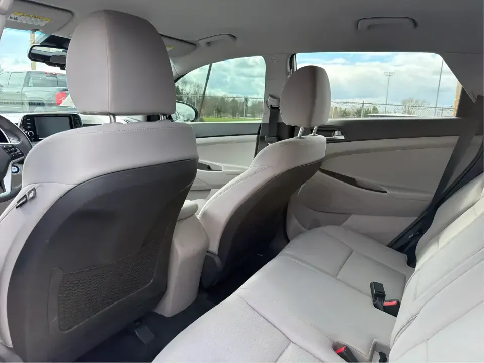 2019 Hyundai Tucson Value (KM8J33A41KU) with an Nu 2L I-4 gasoline direct injection engine, 6A transmission, located at 8750 N County Rd 25A, Piqua, OH, 45356, (937) 908-9800, 40.164391, -84.232513 - Picture your next Ohio weekend: loading up the cooler, tossing sports gear in the back, and cruising from Piqua to a family cookout or a quick getaway-without stressing about space, comfort, or the road ahead. This **2019 Hyundai Tucson Value** in **White Pearl** is the kind of compact SUV that fits - Photo#10