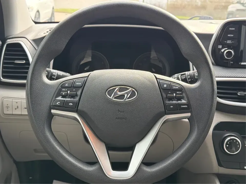2019 Hyundai Tucson Value (KM8J33A41KU) with an Nu 2L I-4 gasoline direct injection engine, 6A transmission, located at 8750 N County Rd 25A, Piqua, OH, 45356, (937) 908-9800, 40.164391, -84.232513 - Picture your next Ohio weekend: loading up the cooler, tossing sports gear in the back, and cruising from Piqua to a family cookout or a quick getaway-without stressing about space, comfort, or the road ahead. This **2019 Hyundai Tucson Value** in **White Pearl** is the kind of compact SUV that fits - Photo#16
