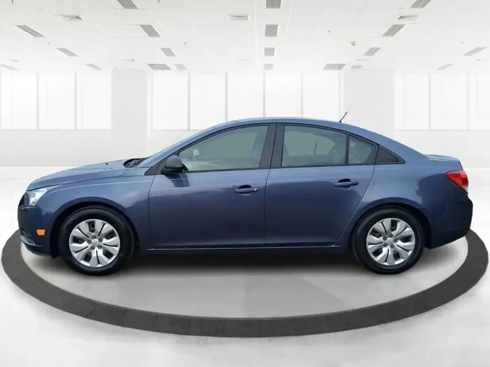 2014 Chevrolet Cruze LS Auto (1G1PA5SG7E7) with an ECOTEC 1.8L I-4 DOHC engine, 6-Speed Automatic transmission, located at 401 Woodman Dr, Riverside, OH, 45431, (937) 908-9800, 39.760899, -84.123421 - Picture a dependable daily commuter that still feels comfortable for weekend errands, school drop-offs, and the occasional road trip down I-675 or US-35-this 2014 Chevrolet Cruze LS Auto is the kind of practical sedan that fits real life in the Dayton area. Finished in Atlantis Blue Metallic, it's e - Photo#5