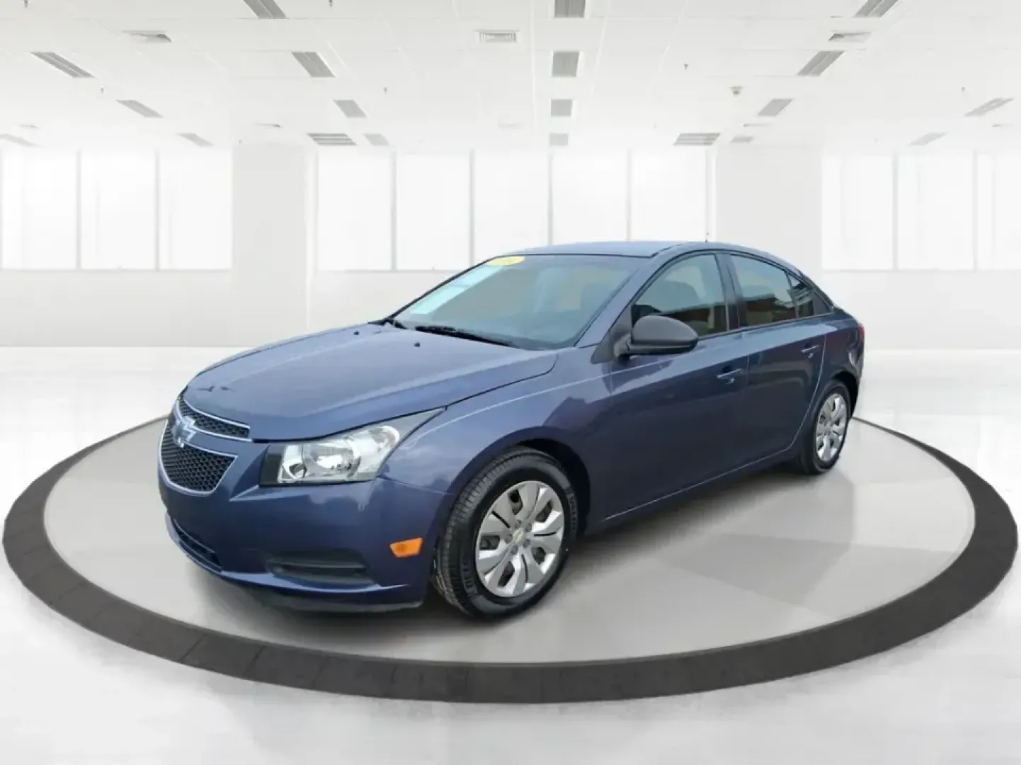 2014 Chevrolet Cruze LS Auto (1G1PA5SG7E7) with an ECOTEC 1.8L I-4 DOHC engine, 6-Speed Automatic transmission, located at 401 Woodman Dr, Riverside, OH, 45431, (937) 908-9800, 39.760899, -84.123421 - Picture a dependable daily commuter that still feels comfortable for weekend errands, school drop-offs, and the occasional road trip down I-675 or US-35-this 2014 Chevrolet Cruze LS Auto is the kind of practical sedan that fits real life in the Dayton area. Finished in Atlantis Blue Metallic, it's e - Photo#8