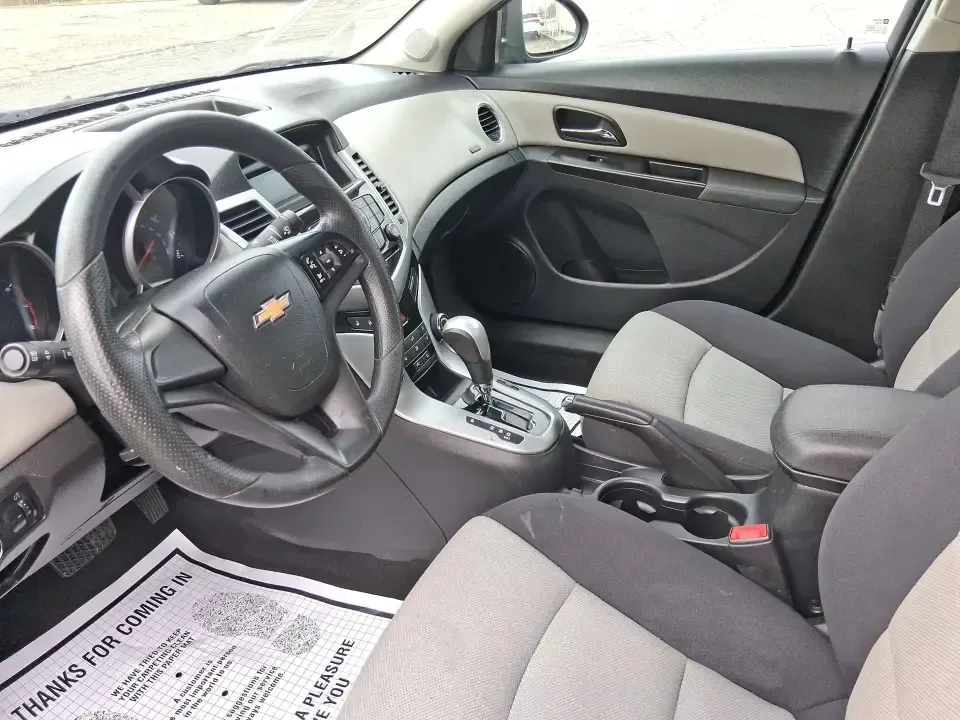 2014 Chevrolet Cruze LS Auto (1G1PA5SG7E7) with an ECOTEC 1.8L I-4 DOHC engine, 6-Speed Automatic transmission, located at 401 Woodman Dr, Riverside, OH, 45431, (937) 908-9800, 39.760899, -84.123421 - Picture a dependable daily commuter that still feels comfortable for weekend errands, school drop-offs, and the occasional road trip down I-675 or US-35-this 2014 Chevrolet Cruze LS Auto is the kind of practical sedan that fits real life in the Dayton area. Finished in Atlantis Blue Metallic, it's e - Photo#9