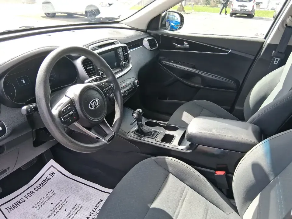 2018 Kia Sorento 2.4L LX (5XYPG4A33JG) with an 2.4L I-4 gasoline direct injection engine, 6A transmission, located at 1184 Kauffman Ave, Fairborn, OH, 45324, (937) 908-9800, 39.807072, -84.030914 - Need one SUV that can handle school drop-offs in the morning, a long commute down I675 in the afternoon, and a weekend road trip to the National Museum of the U.S. Air Force without feeling cramped? This 2018 Kia Sorento LX is built for real-life schedules-comfortable, practical, and ready for every - Photo#9