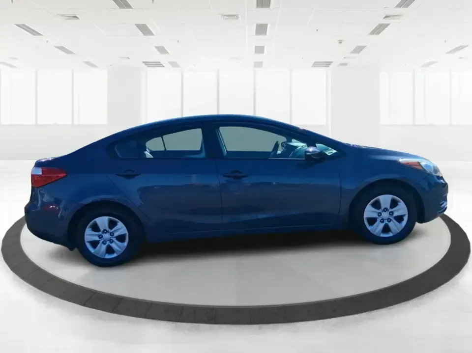 2016 Kia Forte LX (KNAFX4A63G5) with an 1.8L I-4 DOHC engine, 6-Speed Automatic transmission, located at 1951 S Dayton Lakeview Rd., New Carlisle, OH, 45344, (937) 908-9800, 39.890999, -84.050255 - Need a dependable commuter that still feels comfortable for weekend plans around the Miami Valley? This **2016 Kia Forte LX** in **Steel Blue Metallic** is a smart, budget-friendly sedan that fits real life in **Fairborn, Ohio**-whether you're driving to Wright-Patterson AFB, heading to class, or cr - Photo#1