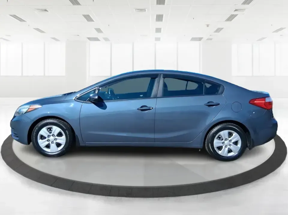 2016 Kia Forte LX (KNAFX4A63G5) with an 1.8L I-4 DOHC engine, 6-Speed Automatic transmission, located at 1951 S Dayton Lakeview Rd., New Carlisle, OH, 45344, (937) 908-9800, 39.890999, -84.050255 - Need a dependable commuter that still feels comfortable for weekend plans around the Miami Valley? This **2016 Kia Forte LX** in **Steel Blue Metallic** is a smart, budget-friendly sedan that fits real life in **Fairborn, Ohio**-whether you're driving to Wright-Patterson AFB, heading to class, or cr - Photo#5