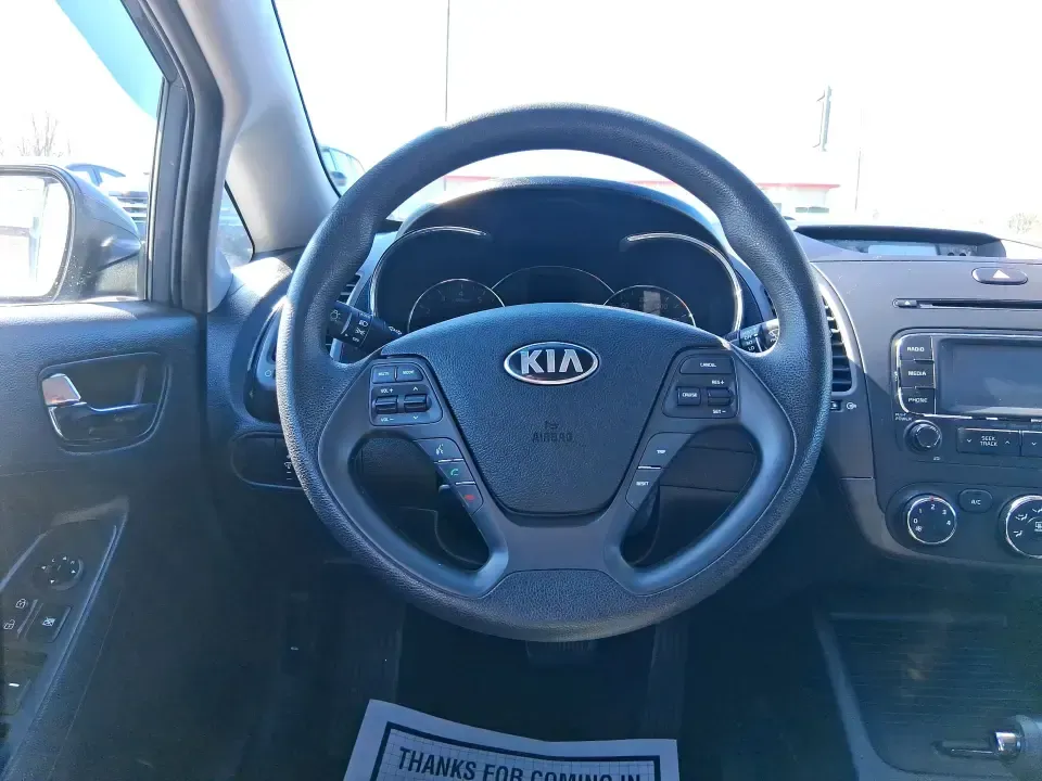 2016 Kia Forte LX (KNAFX4A63G5) with an 1.8L I-4 DOHC engine, 6-Speed Automatic transmission, located at 1951 S Dayton Lakeview Rd., New Carlisle, OH, 45344, (937) 908-9800, 39.890999, -84.050255 - Need a dependable commuter that still feels comfortable for weekend plans around the Miami Valley? This **2016 Kia Forte LX** in **Steel Blue Metallic** is a smart, budget-friendly sedan that fits real life in **Fairborn, Ohio**-whether you're driving to Wright-Patterson AFB, heading to class, or cr - Photo#16