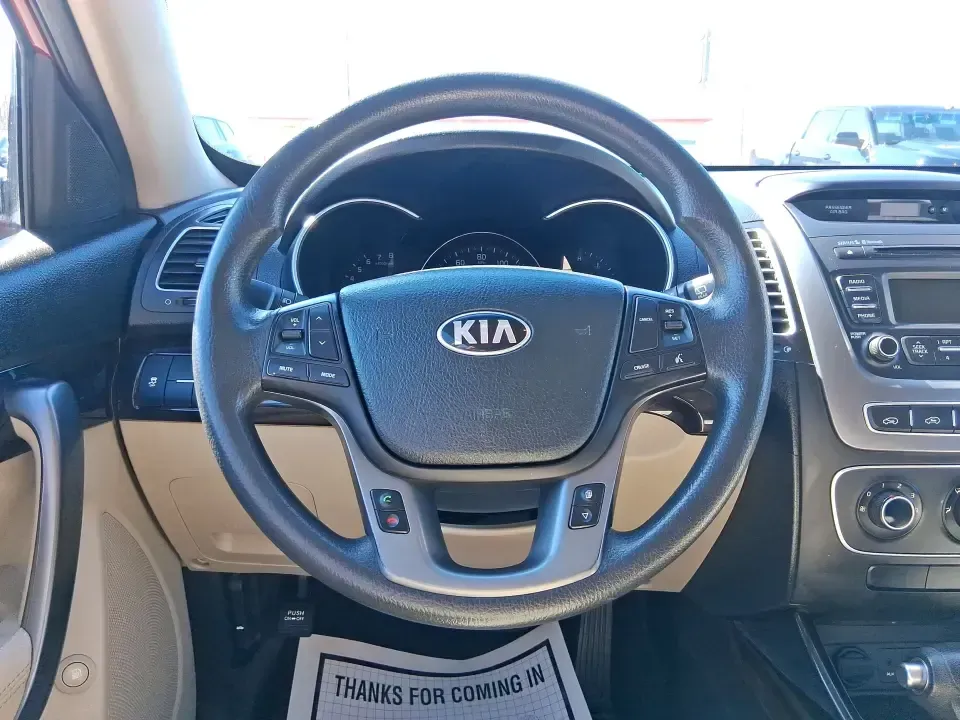 2015 Kia Sorento LX (5XYKTCA67FG) with an 2.4L I-4 gasoline direct injection engine, 6-Speed Automatic transmission, located at 1951 S Dayton Lakeview Rd., New Carlisle, OH, 45344, (937) 908-9800, 39.890999, -84.050255 - Weekend road trips to John Bryan State Park, busy school mornings, or a long commute down I70-this 2015 Kia Sorento LX is the kind of SUV that fits real life in the Miami Valley. Finished in eye-catching Remington Red Metallic, it's a practical, confidence-inspiring choice for growing families, outd - Photo#16