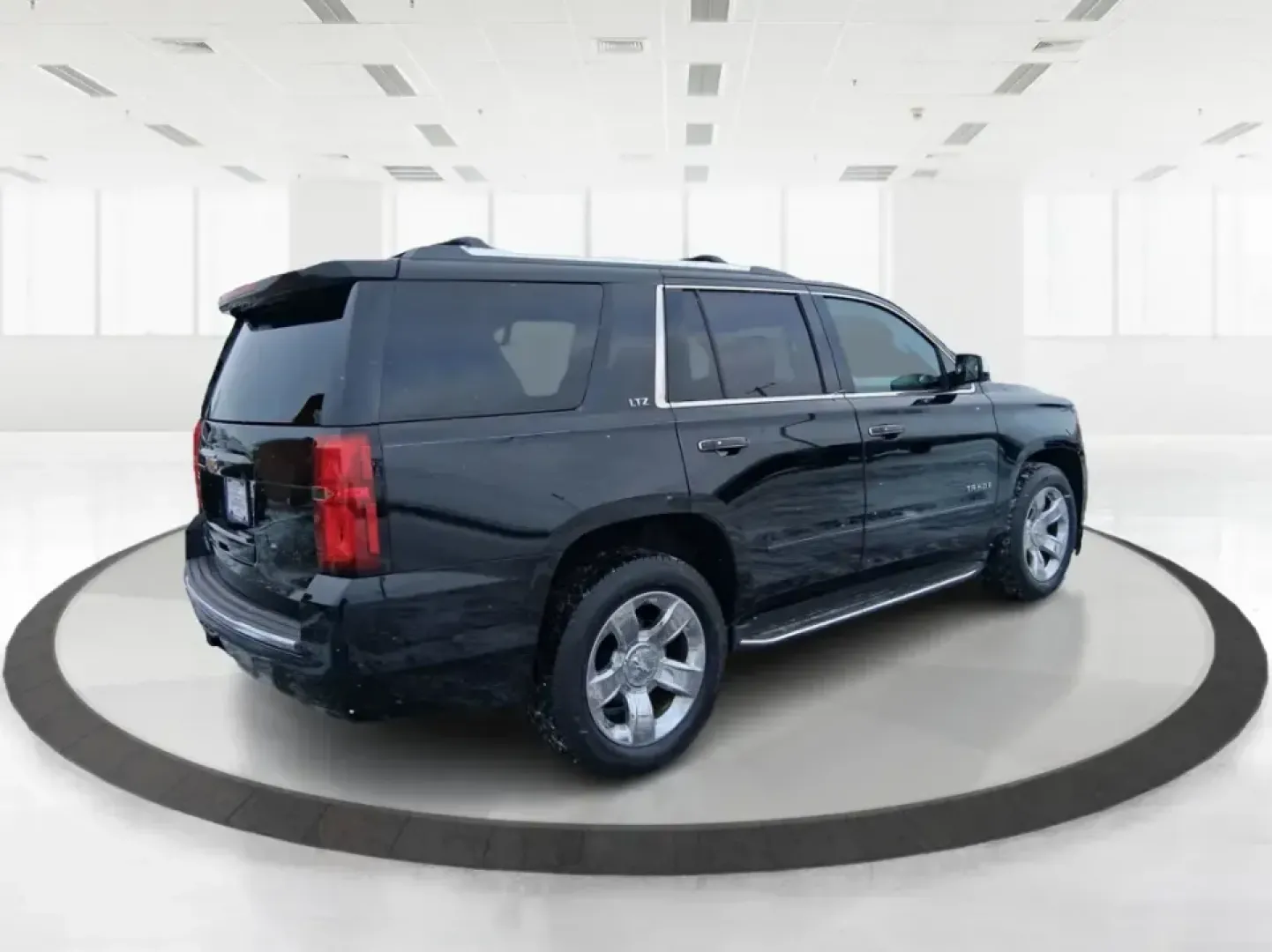 2015 Chevrolet Tahoe LTZ (1GNSKCKC9FR) with an EcoTec3 5.3L V-8 gasoline direct injection engine, 6-Speed Automatic transmission, located at 4508 South Dixie Dr, Moraine, OH, 45439, (937) 908-9800, 39.689976, -84.218452 - Big family weekend at Indian Lake, a road-trip up I-75, or a daily commute with room for coworkers and gear-this 2015 Chevrolet Tahoe LTZ 4WD is built for the kind of life that doesn't fit in a small SUV. Finished in sleek Black and powered by the EcoTec3 5.3L V8 with a smooth 6-speed automatic tran - Photo#2