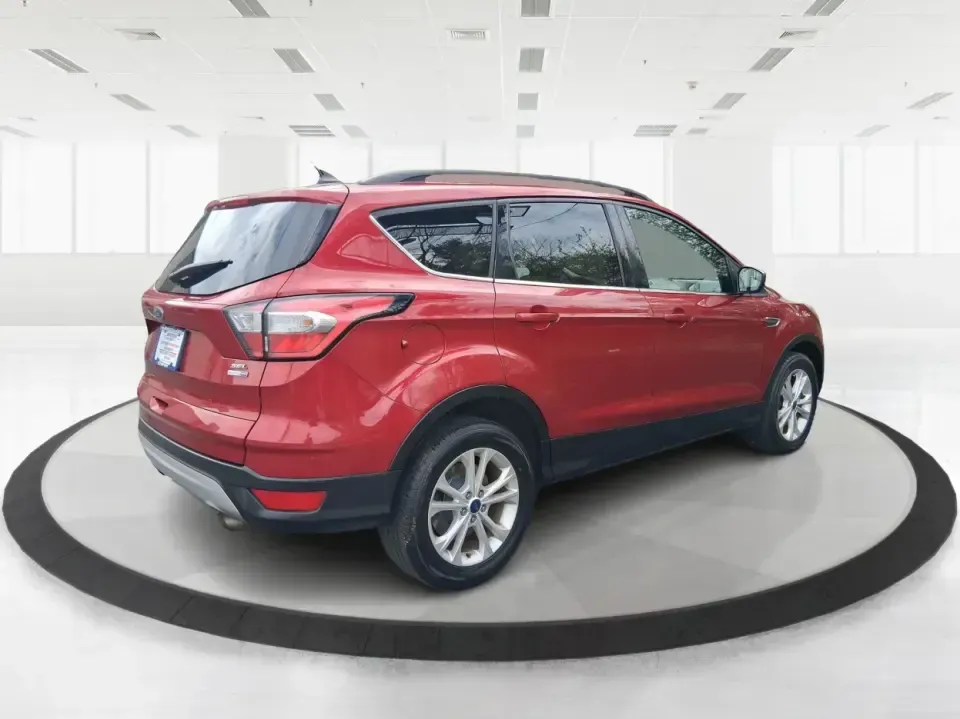 2018 Ford Escape SEL (1FMCU9HD2JU) with an 1.5L L4 DOHC 16V engine, 6A transmission, located at 401 Woodman Dr, Riverside, OH, 45431, (937) 908-9800, 39.760899, -84.123421 - Need a do-it-all SUV that can handle the weekday commute on I-675, quick school drop-offs near Wright-Patterson AFB, and spontaneous weekend getaways to Carillon Historical Park or a lap around Eastwood MetroPark? This 2018 Ford Escape SEL in Ruby Red Metallic Tinted Clearcoat is built for real-life - Photo#2