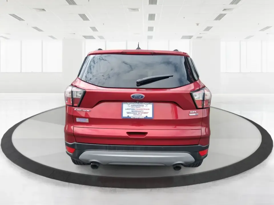 2018 Ford Escape SEL (1FMCU9HD2JU) with an 1.5L L4 DOHC 16V engine, 6A transmission, located at 401 Woodman Dr, Riverside, OH, 45431, (937) 908-9800, 39.760899, -84.123421 - Need a do-it-all SUV that can handle the weekday commute on I-675, quick school drop-offs near Wright-Patterson AFB, and spontaneous weekend getaways to Carillon Historical Park or a lap around Eastwood MetroPark? This 2018 Ford Escape SEL in Ruby Red Metallic Tinted Clearcoat is built for real-life - Photo#3