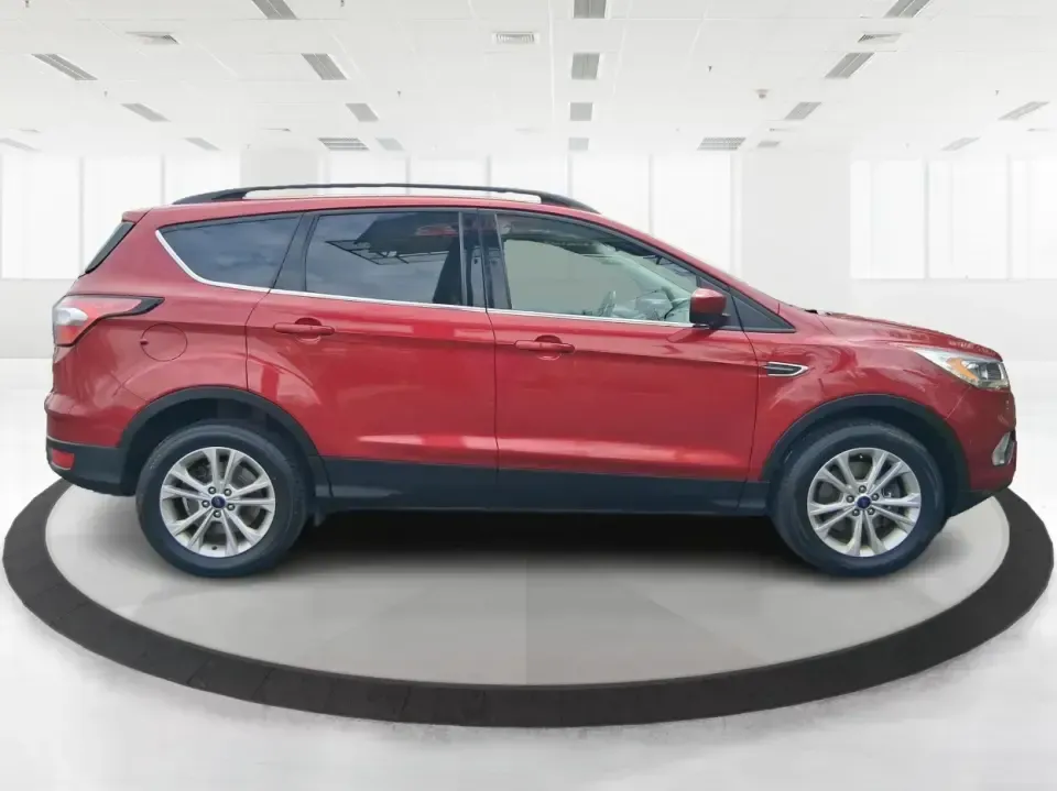 2018 Ford Escape SEL (1FMCU9HD2JU) with an 1.5L L4 DOHC 16V engine, 6A transmission, located at 4508 South Dixie Dr, Moraine, OH, 45439, (937) 908-9800, 39.689976, -84.218452 - Need a do-it-all SUV that can handle the weekday commute on I-675, quick school drop-offs near Wright-Patterson AFB, and spontaneous weekend getaways to Carillon Historical Park or a lap around Eastwood MetroPark? This 2018 Ford Escape SEL in Ruby Red Metallic Tinted Clearcoat is built for real-life - Photo#1