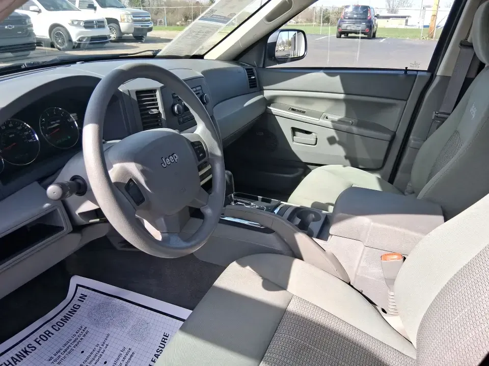 2007 Jeep Grand Cherokee Laredo (1J8GR48K47C) with an 3.7L V6 SOHC 12V engine, 5-Speed Automatic Overdrive transmission, located at 880 E. National Road, Vandalia, OH, 45377, (937) 908-9800, 39.891918, -84.183594 - Weekend getaways to the trails, winter commutes on slick Ohio roads, and family errands across town all get easier when you're in a capable SUV with true 4WD confidence. This **2007 Jeep Grand Cherokee Laredo** is built for drivers who want classic Jeep utility without giving up everyday comfort-ide - Photo#9
